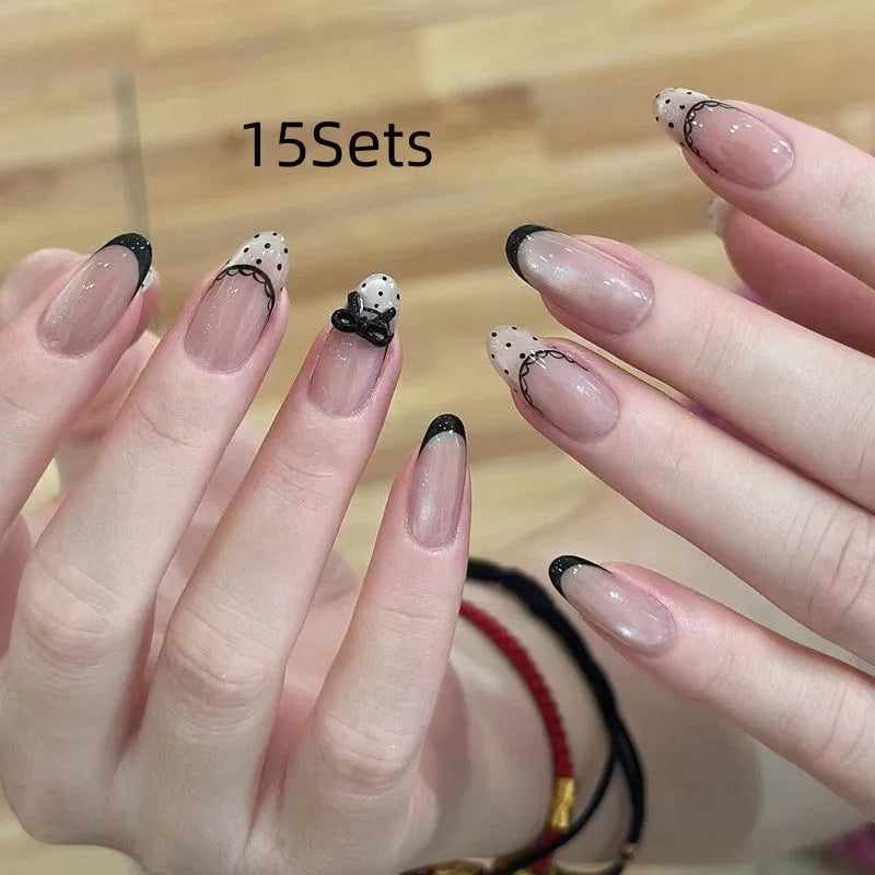 Set of colourful press-on false nails for girls with adhesive tabs on a white background.