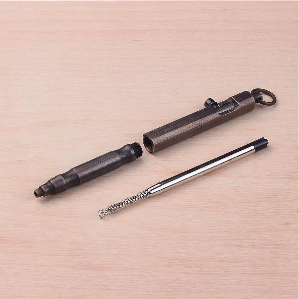 Brass tactical pen with hexagonal bolt machine gun design in brass or black finish
