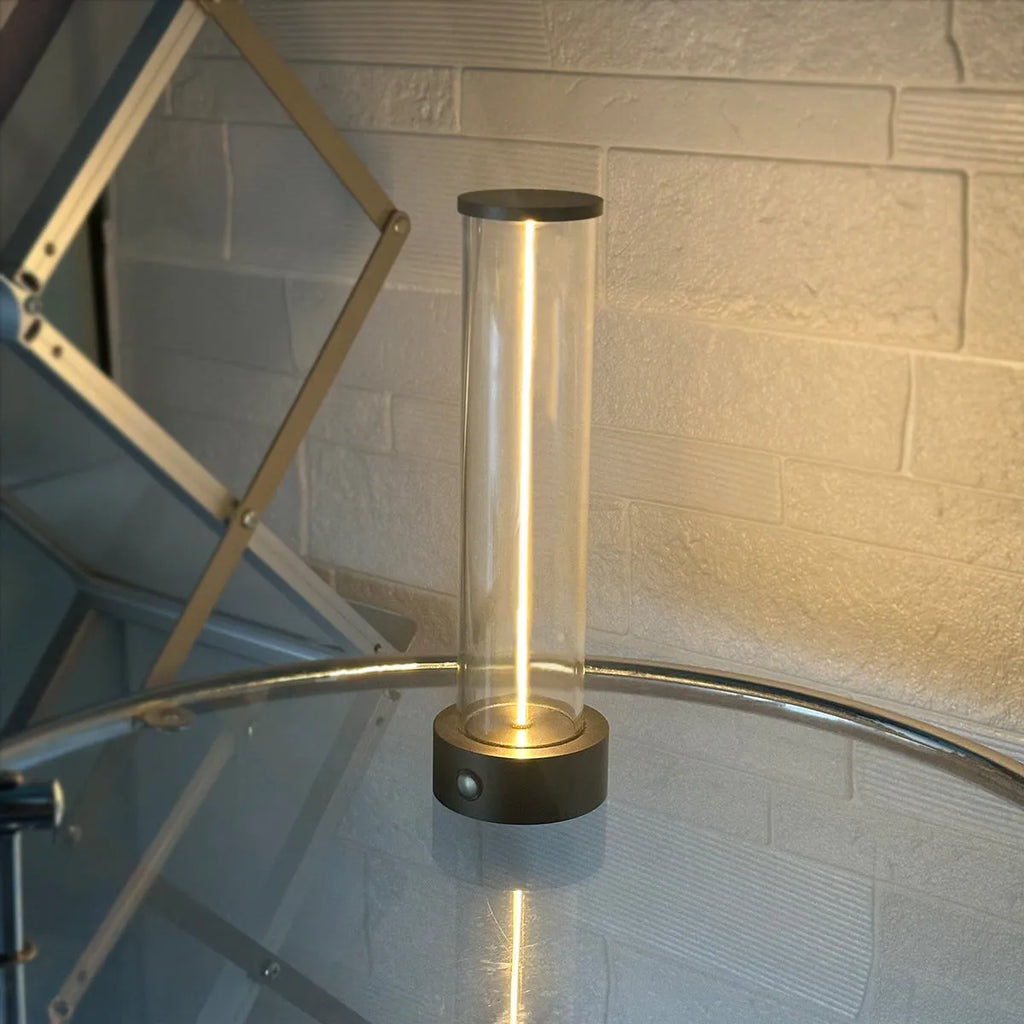 Modern glass and metal LED line light strip with magnetic back for USB-charged night lighting