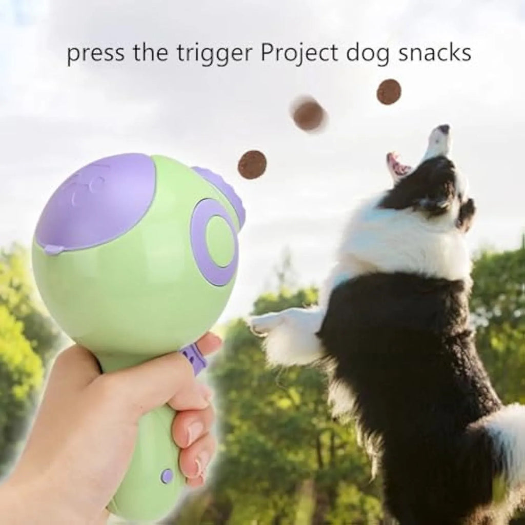 Green, orange or pink dog treat launcher toy measuring 15.5 x 9 x 8.5 cm for interactive play