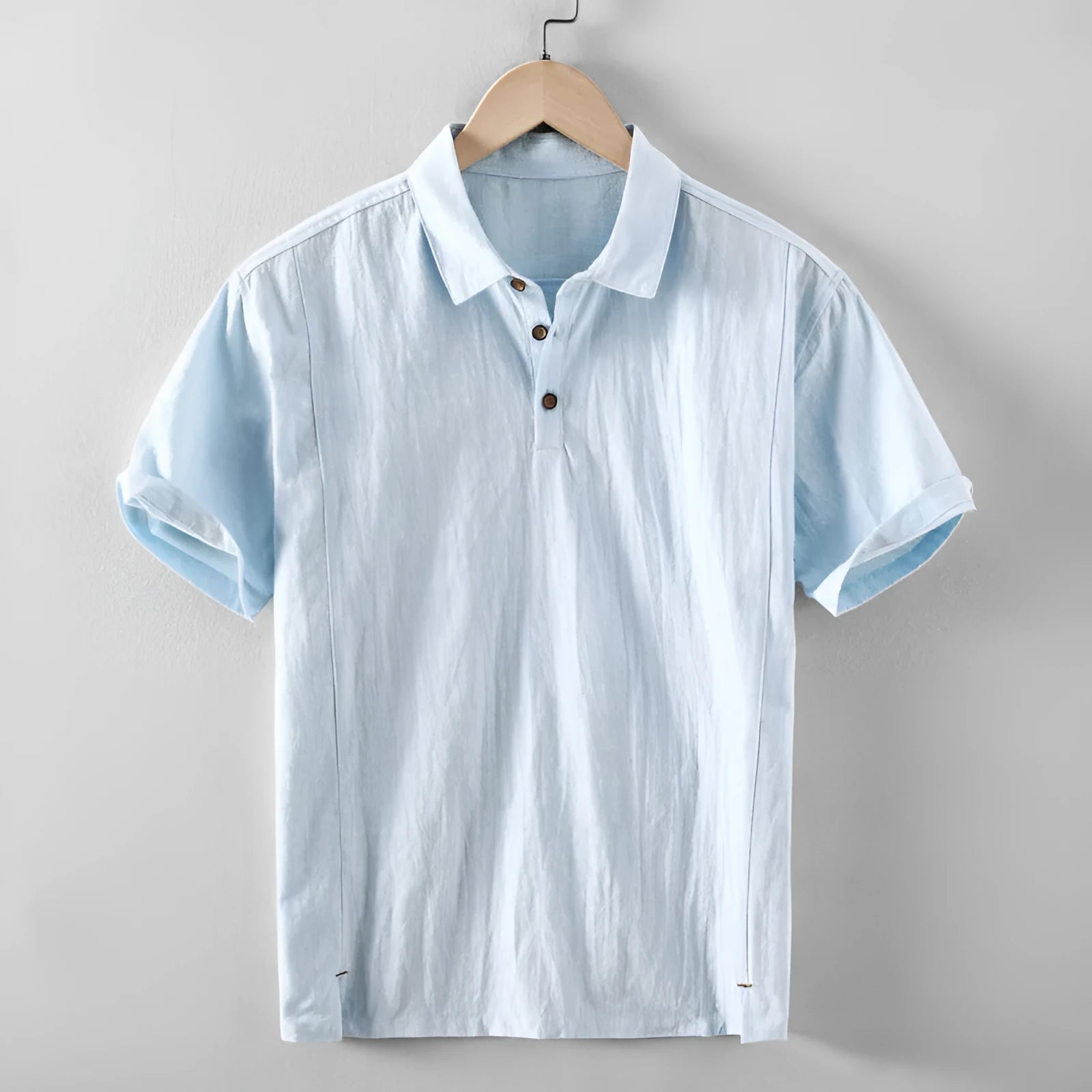 Man wearing a loose fit, light grey linen casual shirt.