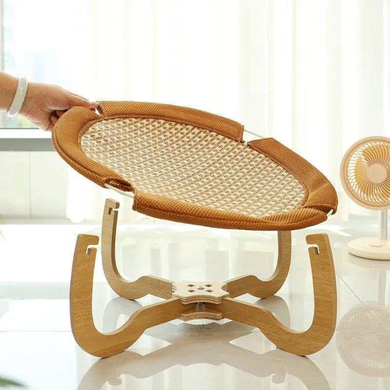 Brown woven rattan pet hammock bed measuring 46cm square raised off the ground