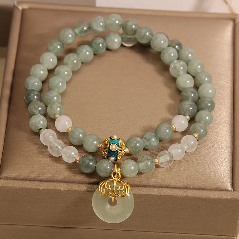 Women's double-layer crystal bracelet with peace buckle in oil emerald colour and rhinestone detailing