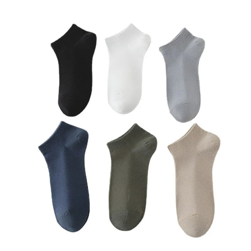 Low-cut polyester boat socks in solid colour on foot showing discreet design below ankle