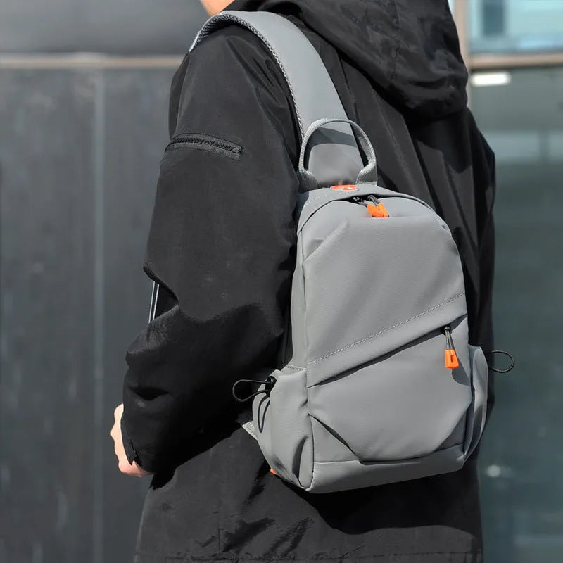 Men's black polyester crossbody bag with single shoulder strap and waterproof features