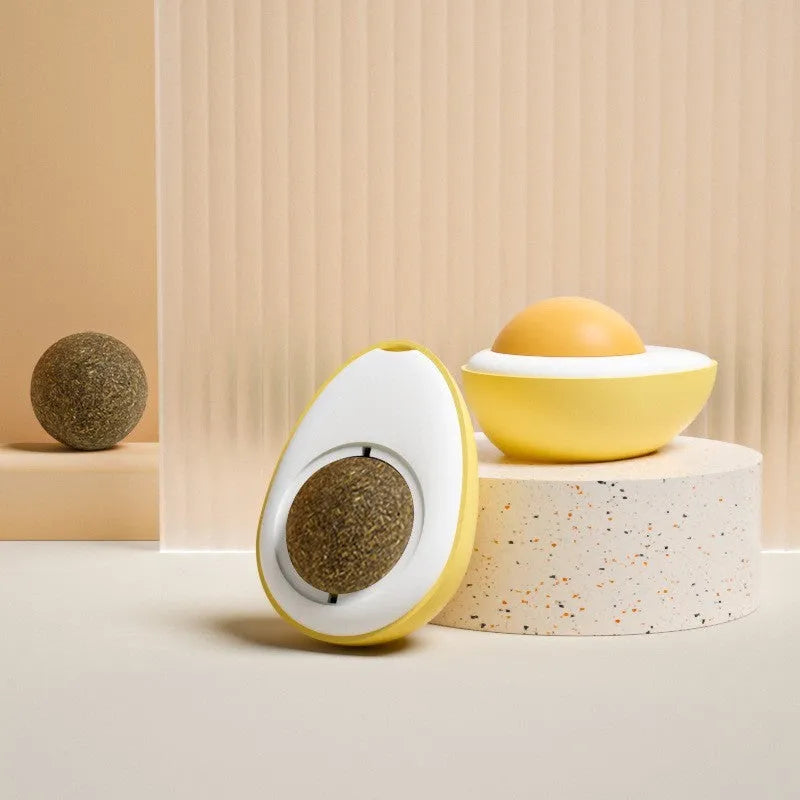 Soft plush catnip ball toy attached to wall for interactive feline play