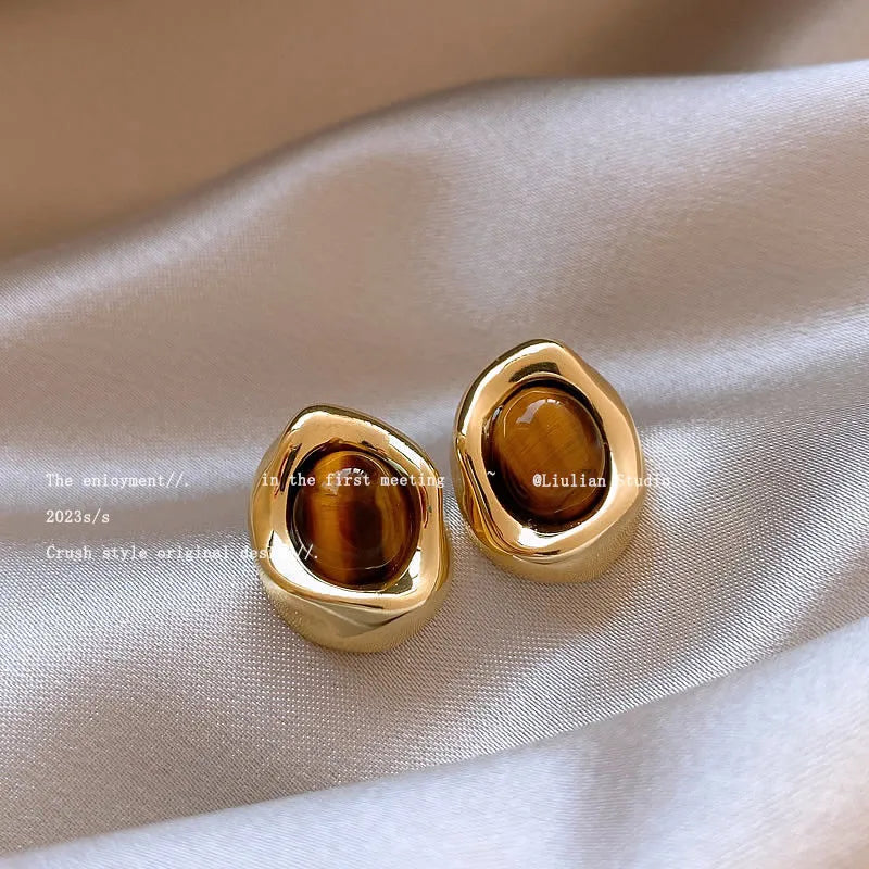Three pairs of geometric alloy ear rings with tassel elements in different electroplated finishes
