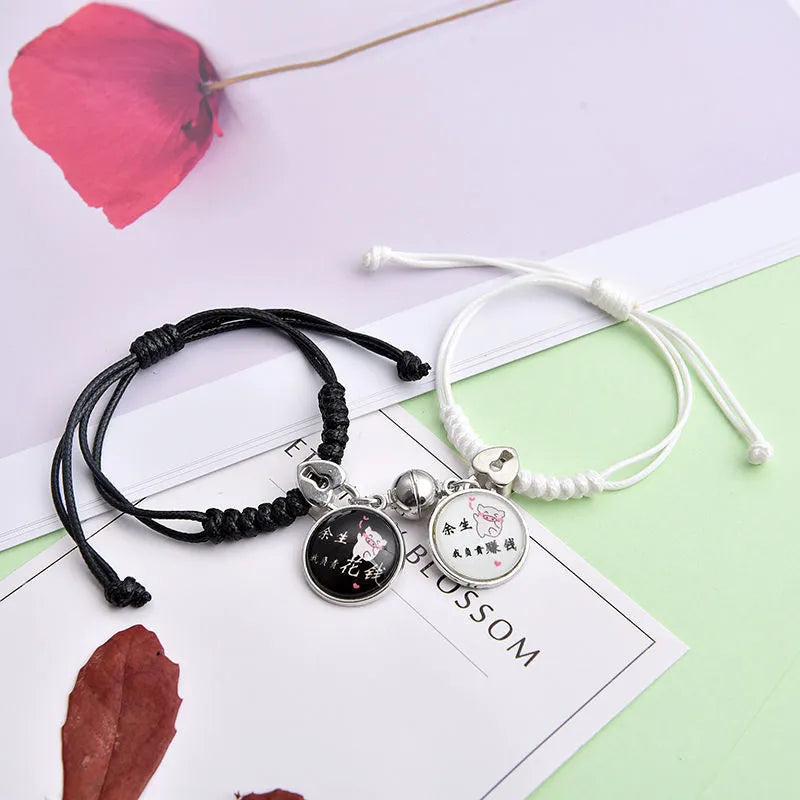 Alloy couple bracelets with magnet closure showing various design options including crown, clover, and text patterns