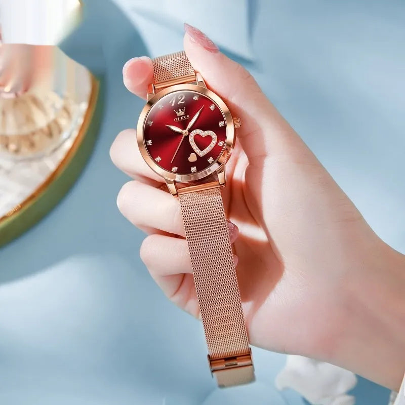 Women's fashion watch with rose gold mesh strap showing six dial colour options: white, black, blue, red, pink, green.