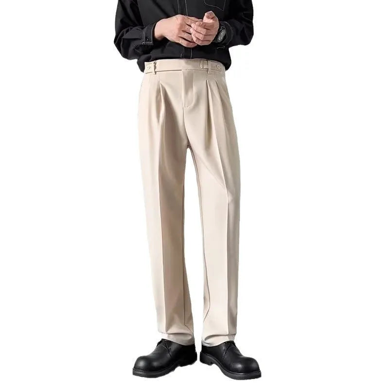 Men's straight-loose fit suit trousers in apricot colour hanging on a hanger.