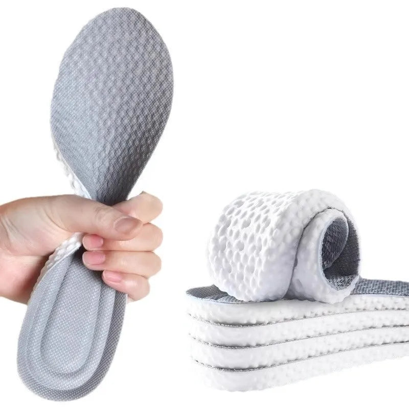 Grey, black, and orange PU foam sports insoles on a white background, showing trim-to-fit edges.