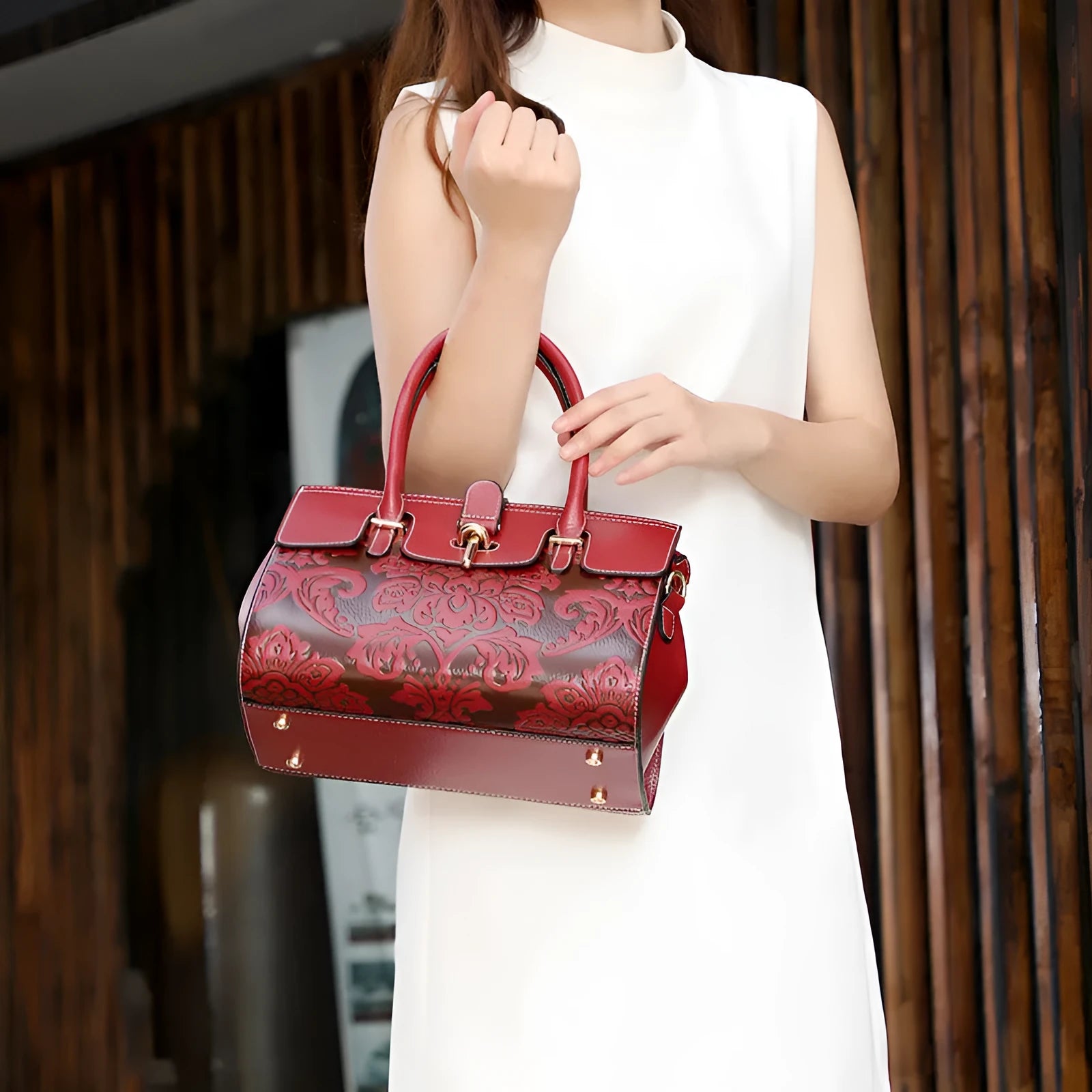 Genuine leather vintage crossbody bag with oval shape and embossed pattern in black colour
