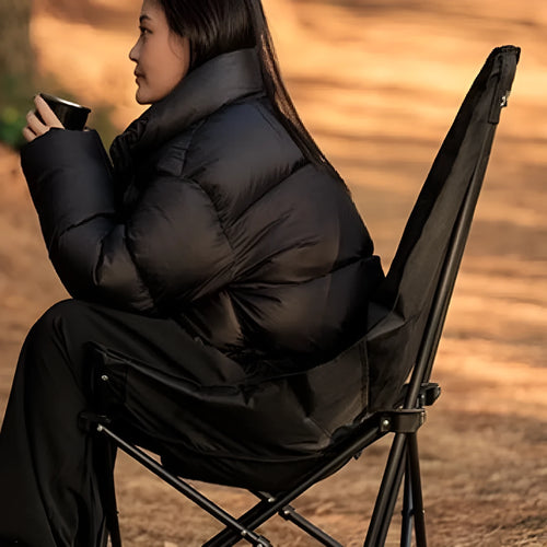 Night black portable camping recliner moon chair with Oxford cloth construction and adjustable backrest folded with carry bag