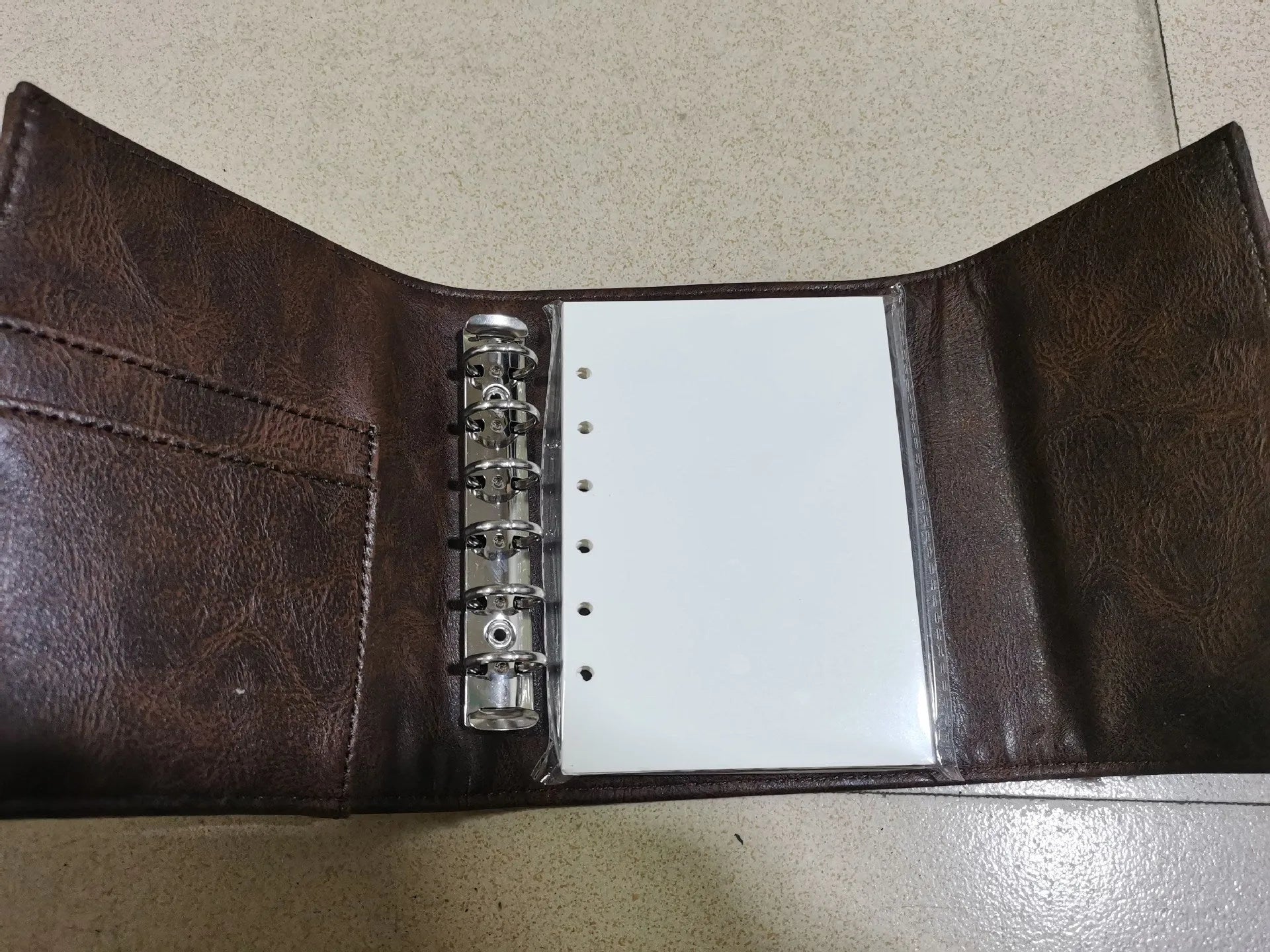 Brown retro leather buckle notebook with loose-leaf binder binding, A7 size with raw wood pulp paper