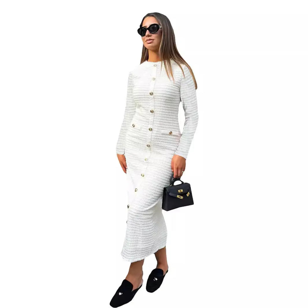 Black slim fit knitted dress with long sleeves, a French retro collar, and button detailing.
