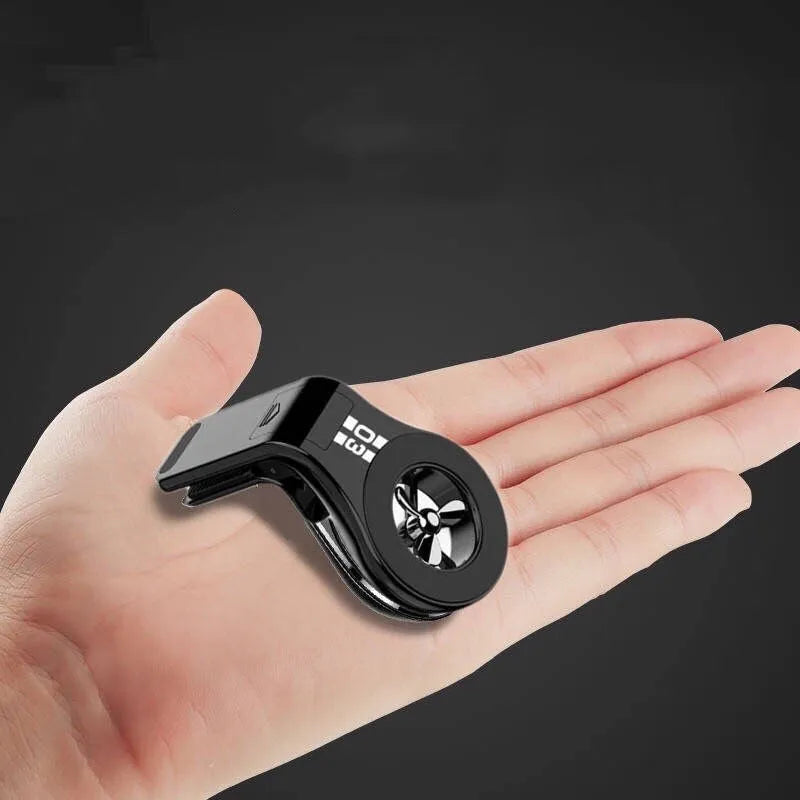 Magnetic car phone holder mounted on car air vent with smartphone attached