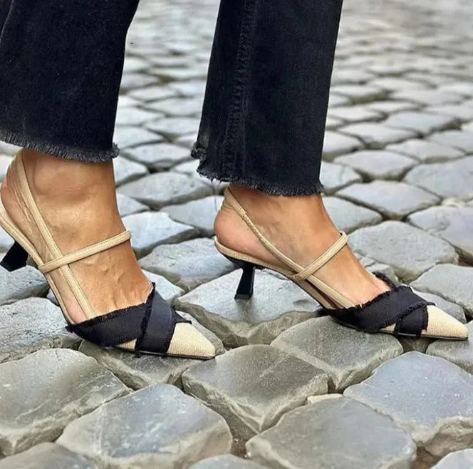 Apricot and black colour-block women's stiletto sandals with a pointed toe and ankle buckle.