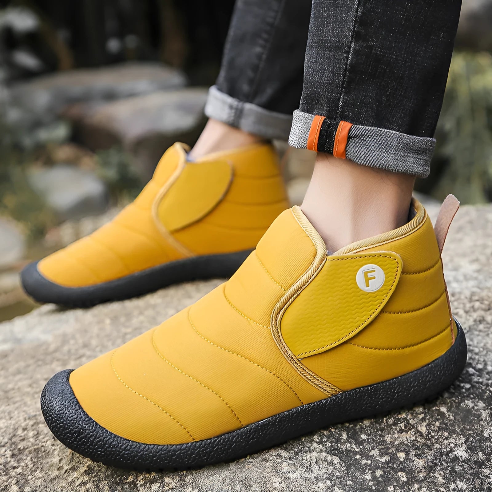 Men's waterproof snow boots in black with a cotton upper and thick rubber sole.