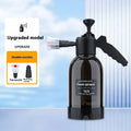 Black 2L hand-held foam spray watering can with two nozzles and a switch lock for car washing and gardening.