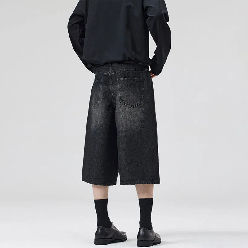 Men's light blue cotton denim shorts with a straight leg and cropped length on a hanger