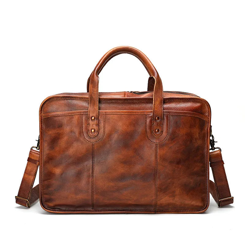 Large brown leather men's briefcase showing multiple internal compartments and organisation pockets