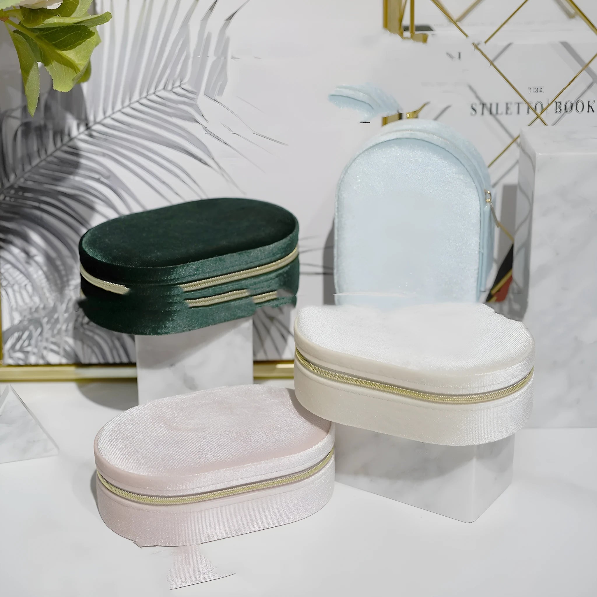 Oval velvet jewelry storage box in lake blue colour showing compact 15x10x5cm dimensions with flannel interior