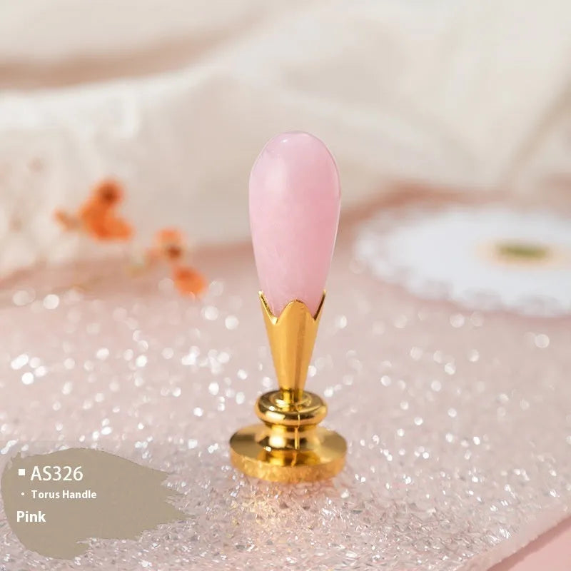 Wooden wax seal handle in a selection of different colour and decorative finishes.