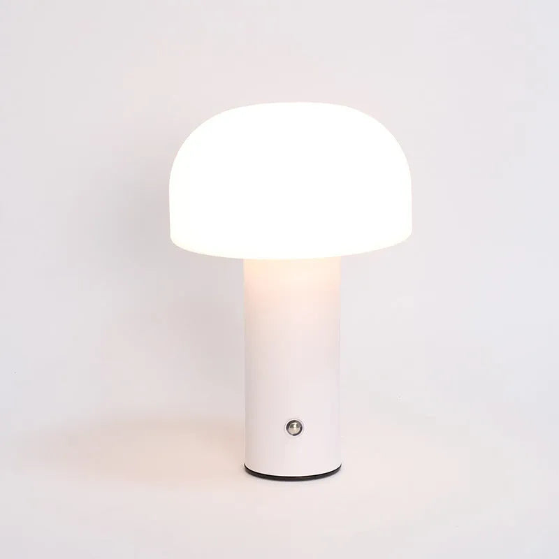 USB-powered dual-purpose table lamp providing atmospheric lighting and charging in black, green, orange, or white