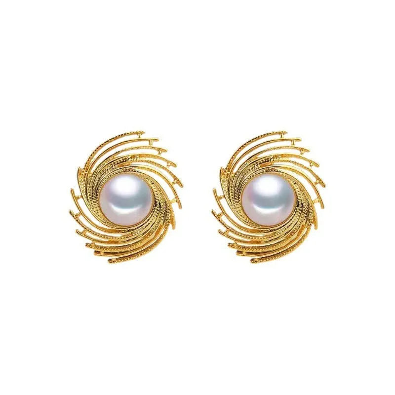 A pair of vintage-style alloy flower earrings with pearl-coloured details and an irregular shape.