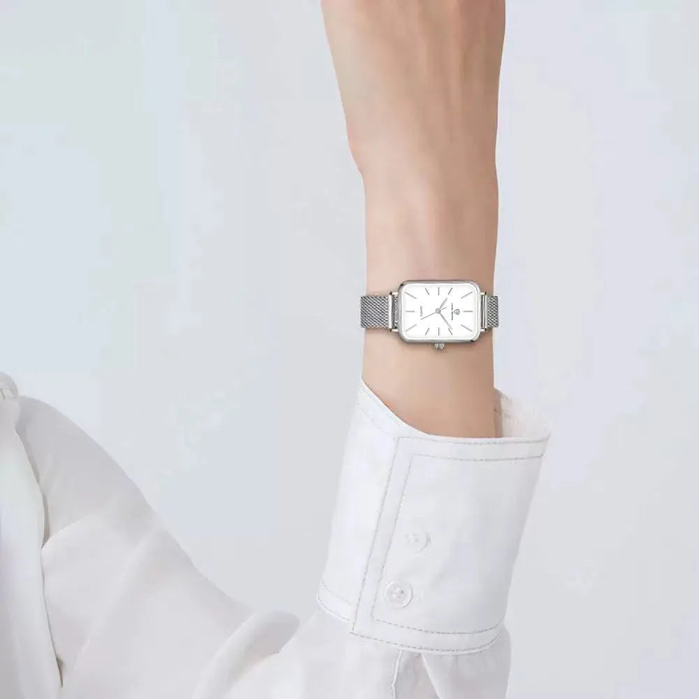 Women's waterproof quartz watch with woven steel strap in rose gold colour showing alloy case and mineral glass
