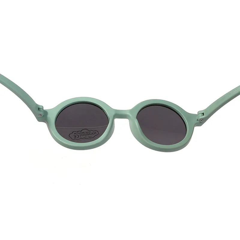 Children's silicone sunglasses with round frame and polarised lenses in multiple colours for 0-3 year olds