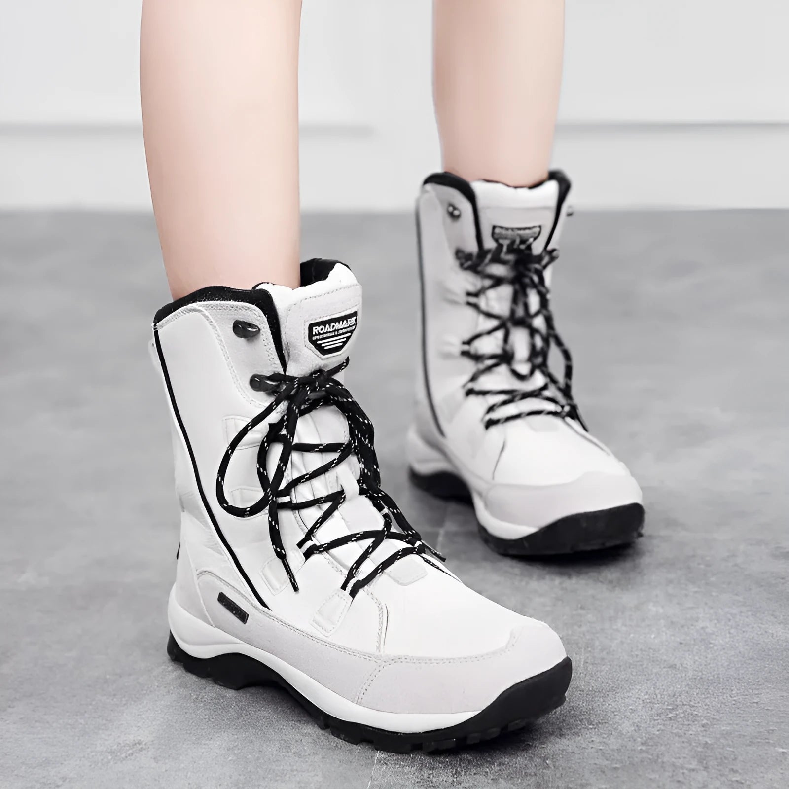 Women's genuine leather thermal snow boots in black, mid-calf length with rubber sole
