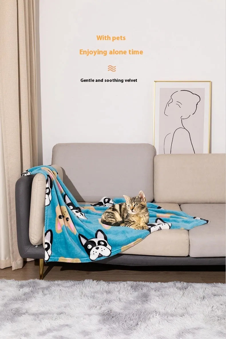 Blue cartoon dog paw patterned flannel pet blanket laid flat, showing its size.