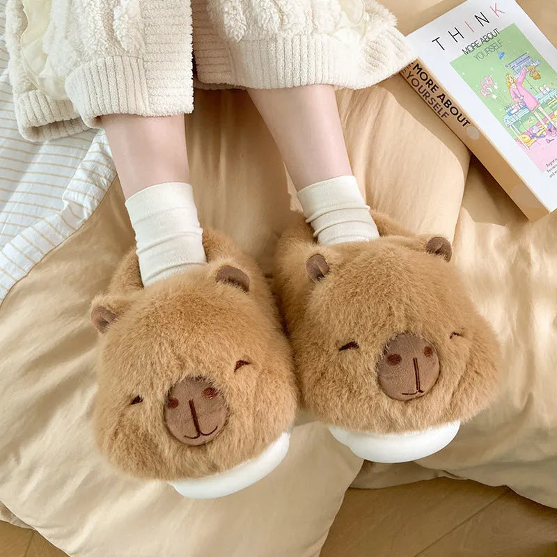 Light brown plush women's winter slippers with artificial wool lining and a round toe.