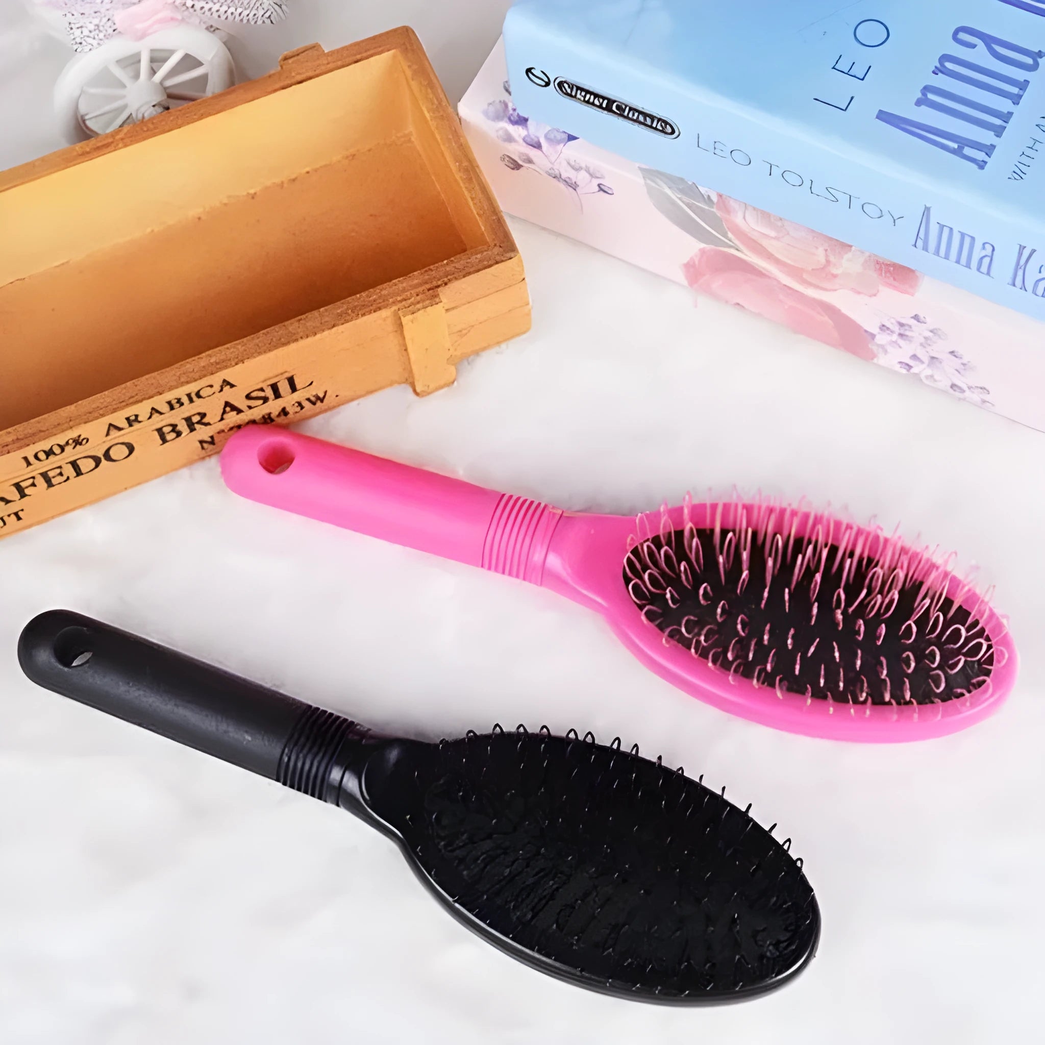Black and pink ABS plastic hair extension comb with ring teeth measuring 22cm by 6cm