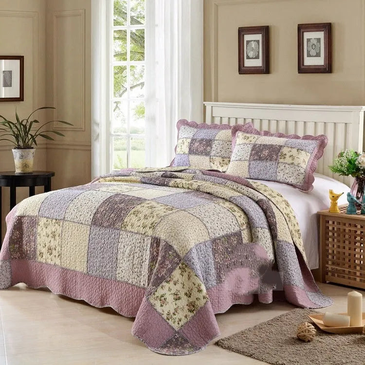 Washed pure cotton quilted bedspread set with one large cover and two pillowcases on a bed.
