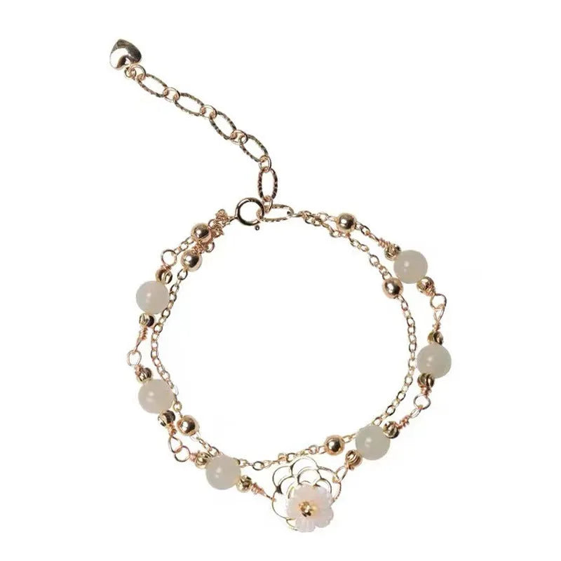 Yellow gold electroplated copper bracelet with shell flower butterfly and Hetian jade design for women