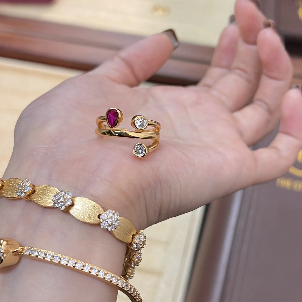 Double-headed irregular cross diamond ring in two-tone colours on a copper base.