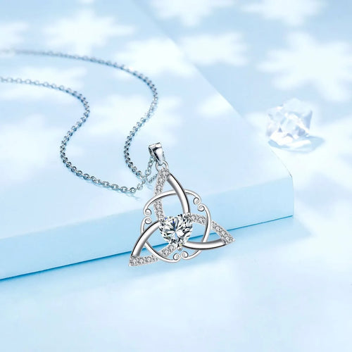 Close-up of a women's Celtic knot pendant necklace with geometric design in a choice of blue, lvzuan, red diamond or white diamond colour.