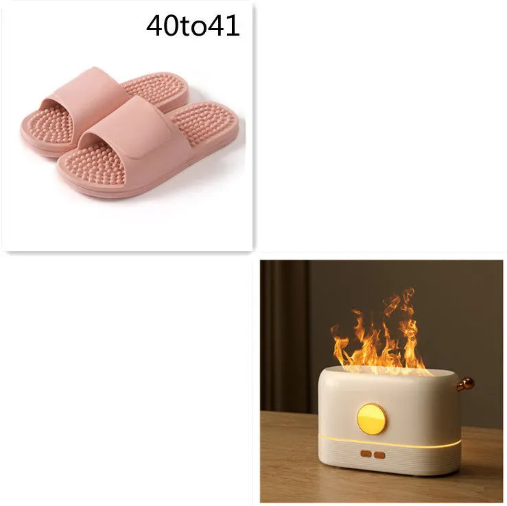 Black simulation flame USB humidifier with 200ml tank on a desktop showing mist and light effect