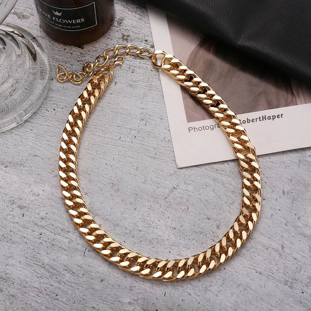 Women's thick chain necklace in dense gold colour measuring 32cm length with simple solid colour design