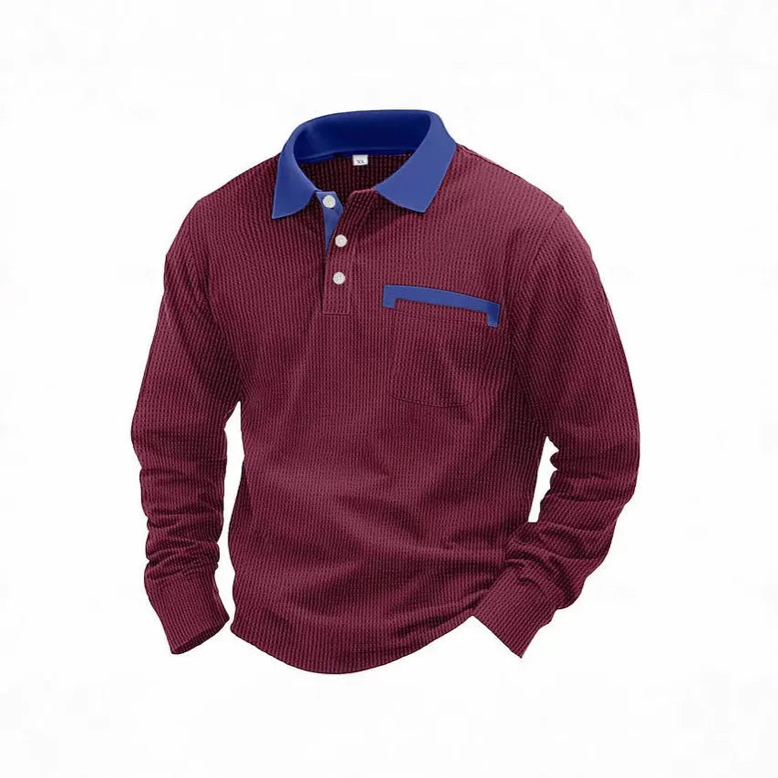 Man modelling a loose-fit long sleeve polo shirt with a waffle-texture fabric in a solid colour.