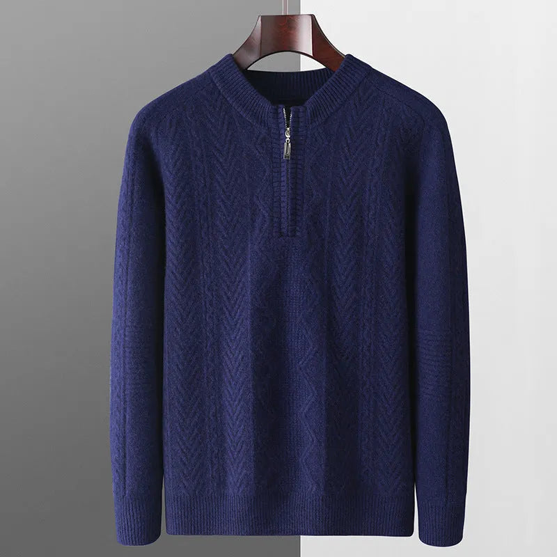 Man wearing a milky white half-zip wool sweater with a diamond pattern, showing loose fit and long sleeves.