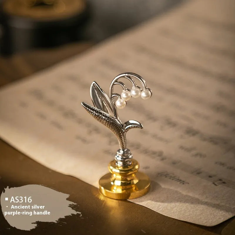 Wooden wax seal handle in a selection of different colour and decorative finishes.