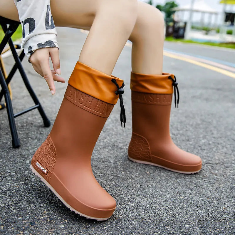Women's PVC rain boots in apricot colour with non-slip soles and waterproof mouth detailing