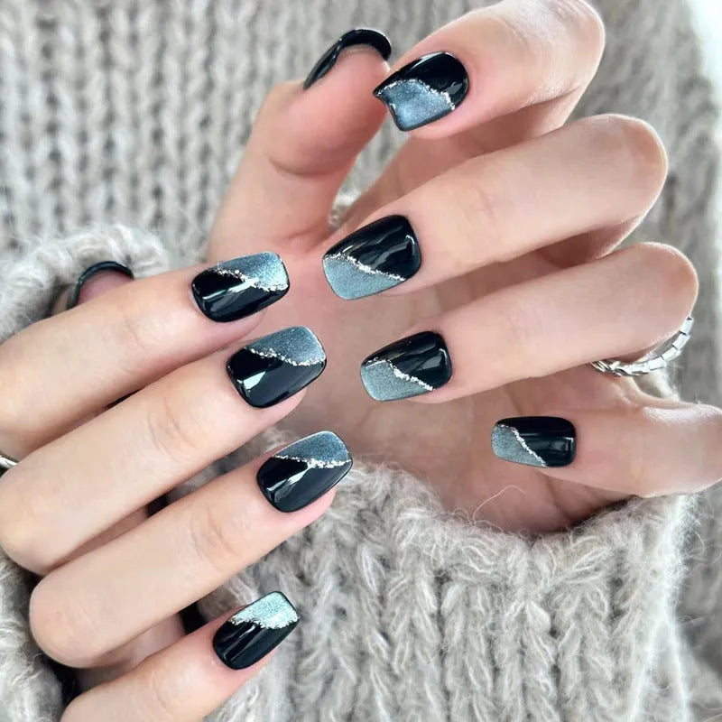 Set of colourful press-on false nails for girls with adhesive tabs on a white background.