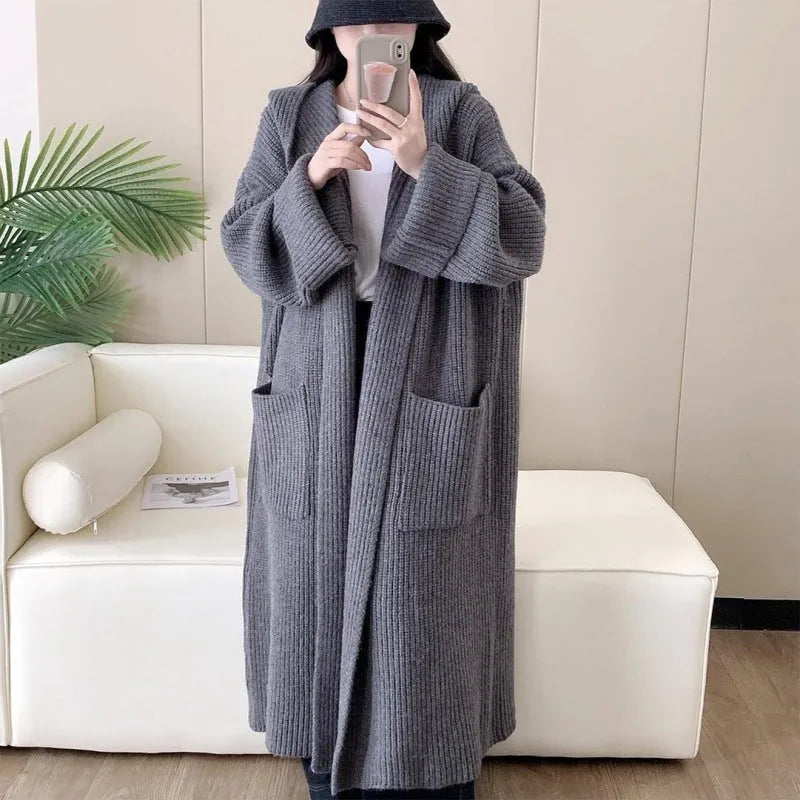 Loose hooded acrylic cardigan sweatshirt in milky white colour showing raglan sleeves and 80cm length