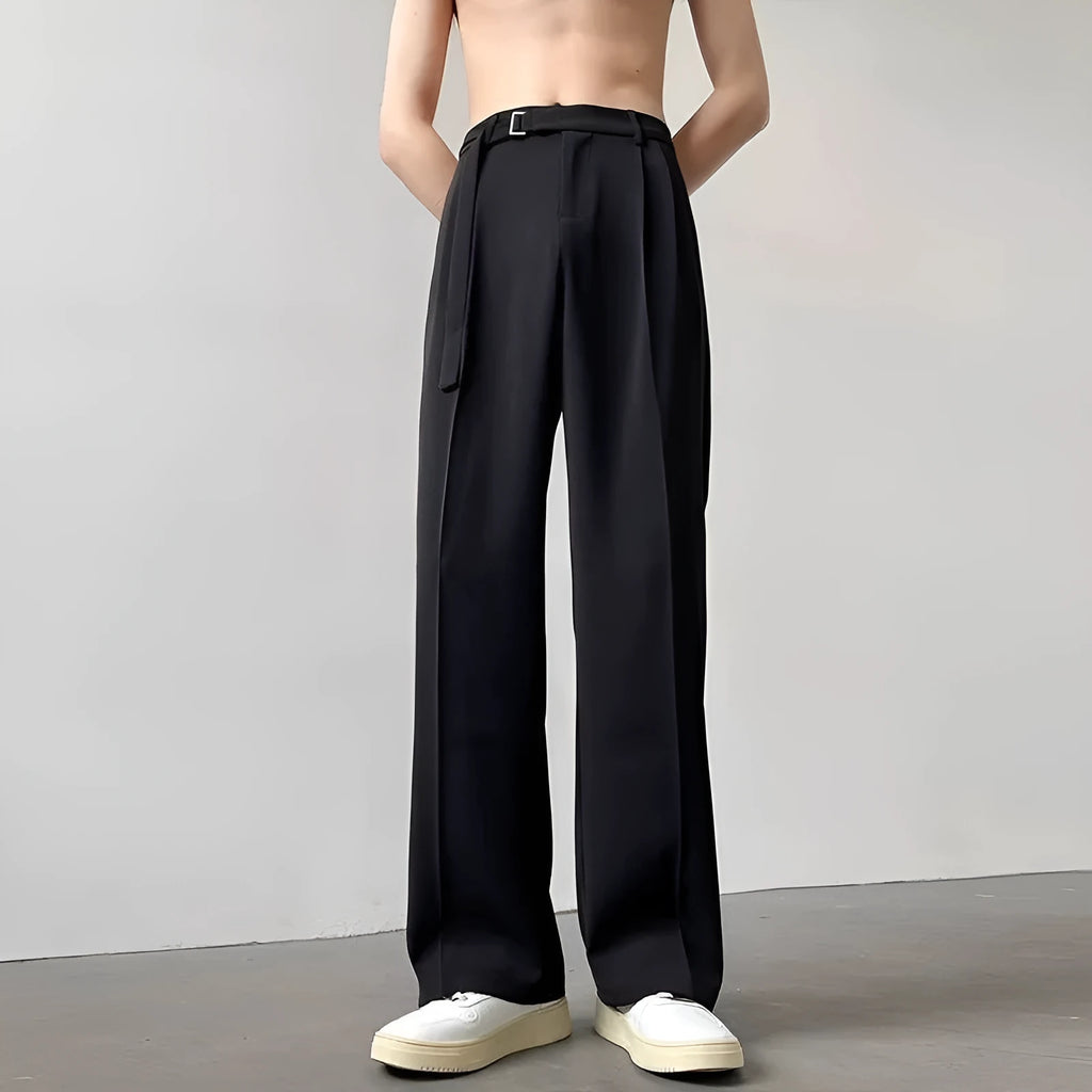 Black straight leg wide trousers on hanger showing loose fit and non-ironing fabric