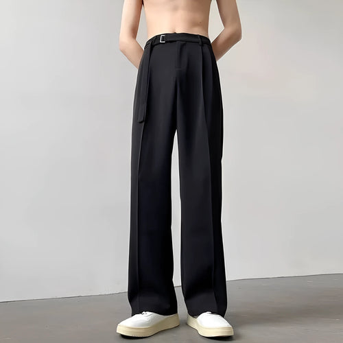 Black straight leg wide trousers on hanger showing loose fit and non-ironing fabric