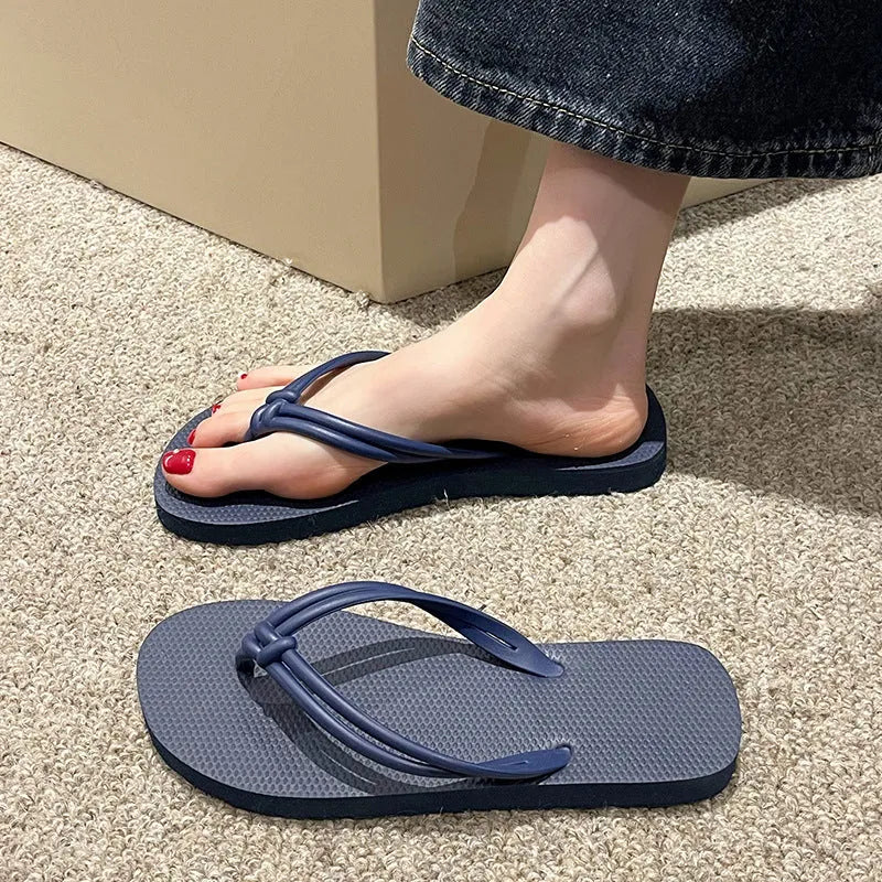 Men's PVC flip flops with toe covering design in various colours on white background